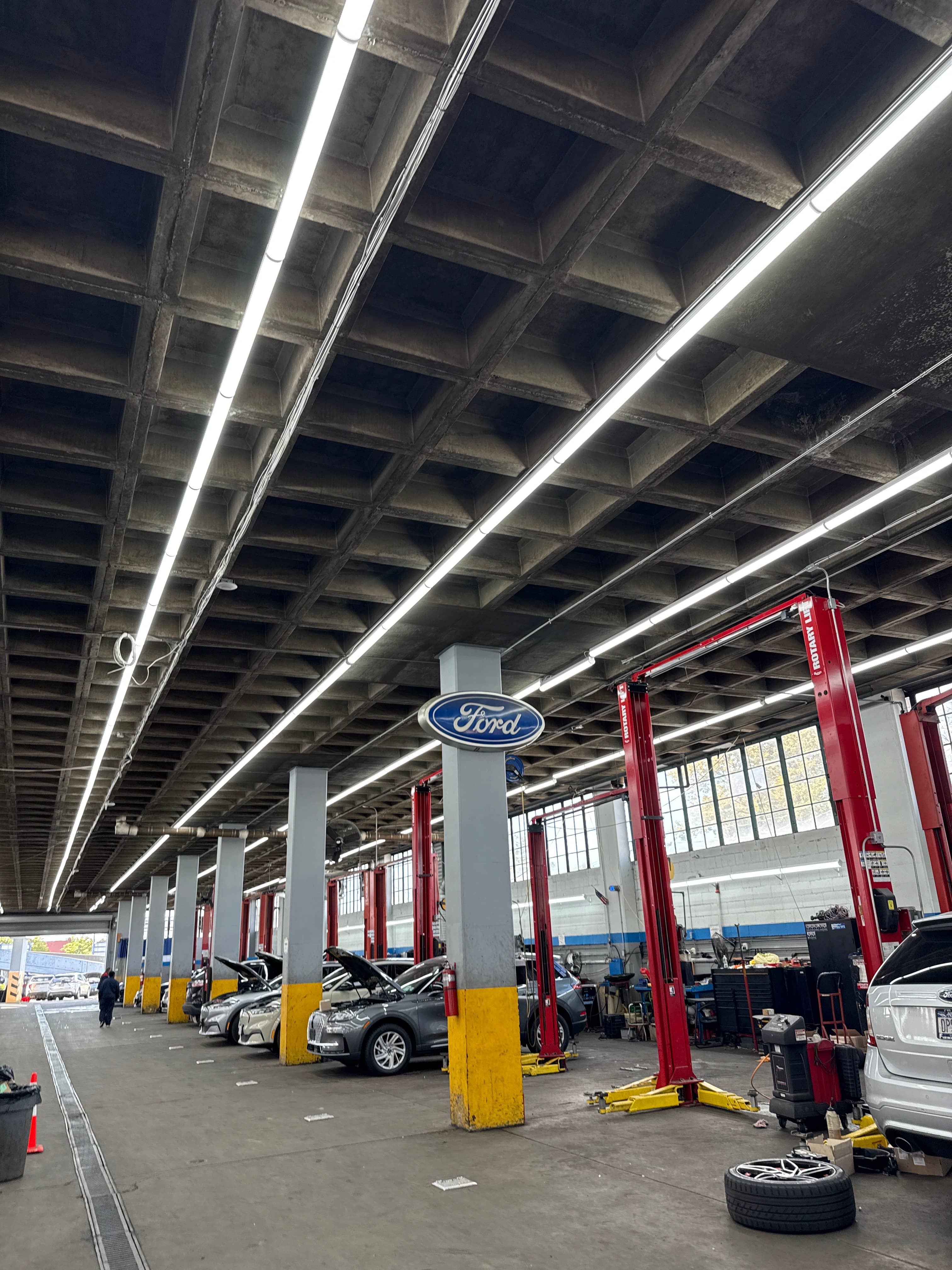 Newly retrofitted high-bay LED fixtures illuminating a distribution center