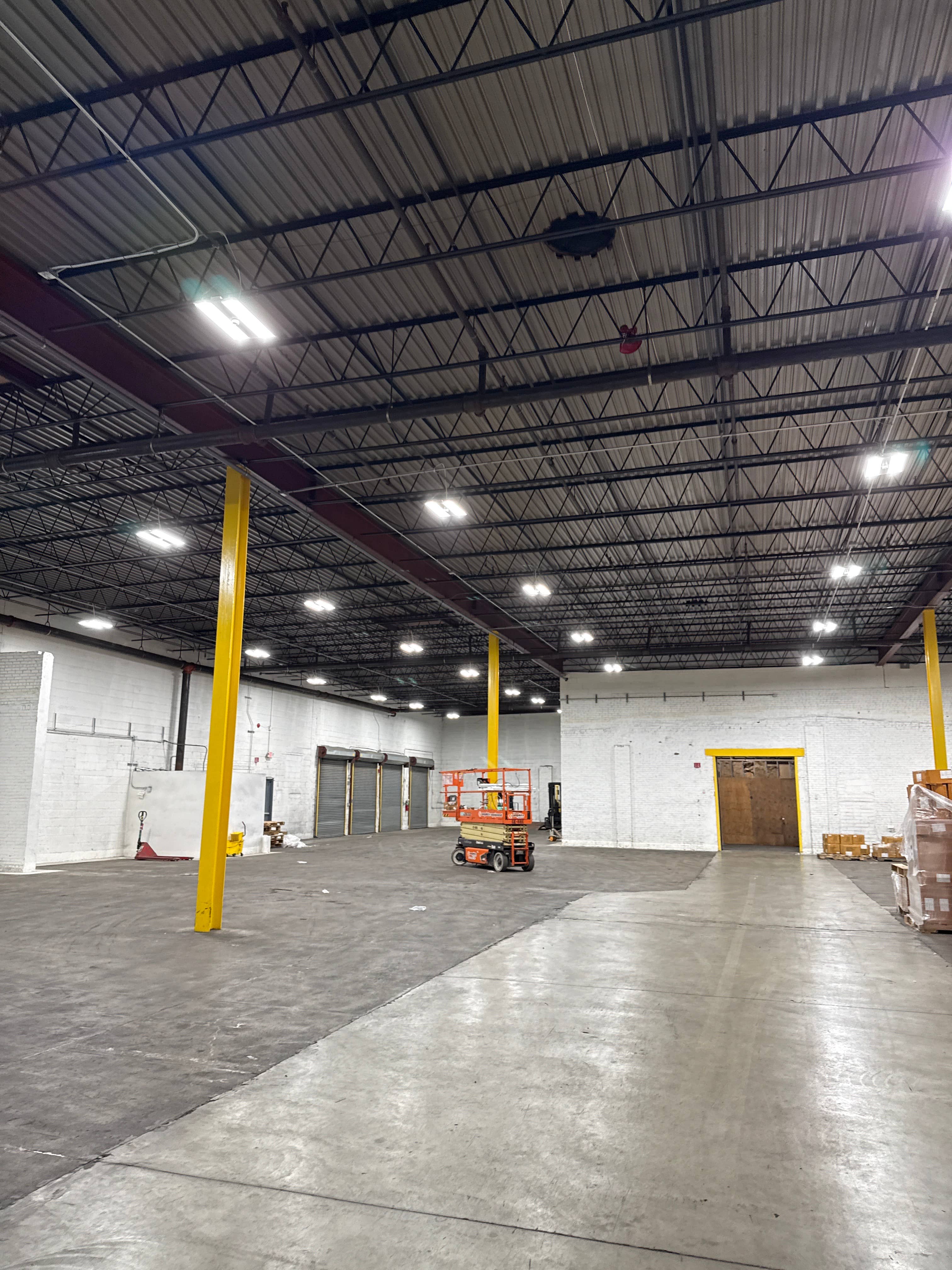 VK Light Solutions crew installing commercial LED fixtures on site